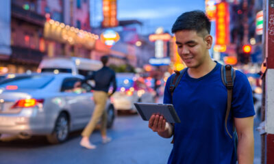 Portrait,Of,Young,Handsome,Asian,Tourist,Man,Exploring,At,Chinatown