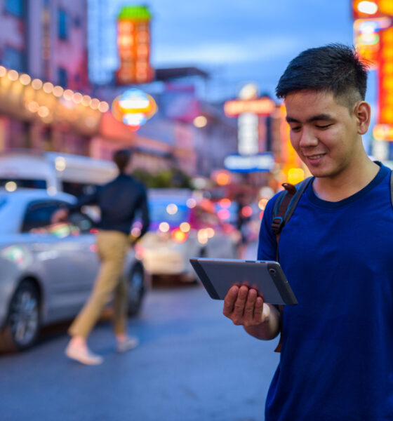 Portrait,Of,Young,Handsome,Asian,Tourist,Man,Exploring,At,Chinatown