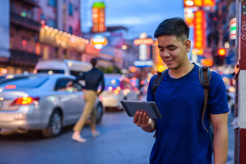 Portrait,Of,Young,Handsome,Asian,Tourist,Man,Exploring,At,Chinatown